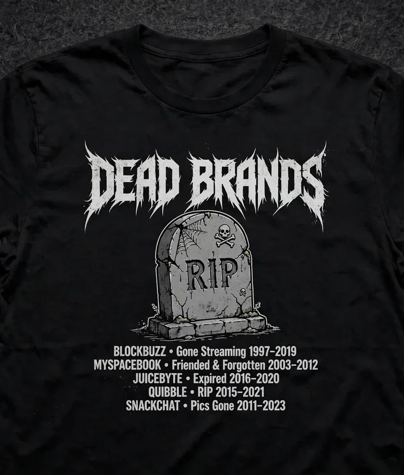 RIP Tombstone tee — black shirt with metal-lettered DEAD BRANDS over a cartoon tombstone of dead brands
